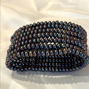 Faux black pearl multi-strand bracelet.